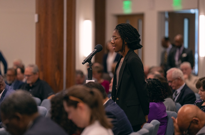 Joi McClellan, a young adult delegate at the 2023 NAD Year-End Meeting, as the meeting's prayer convener, offers prayer on Oct. 27. Photo by Pieter Damsteegt