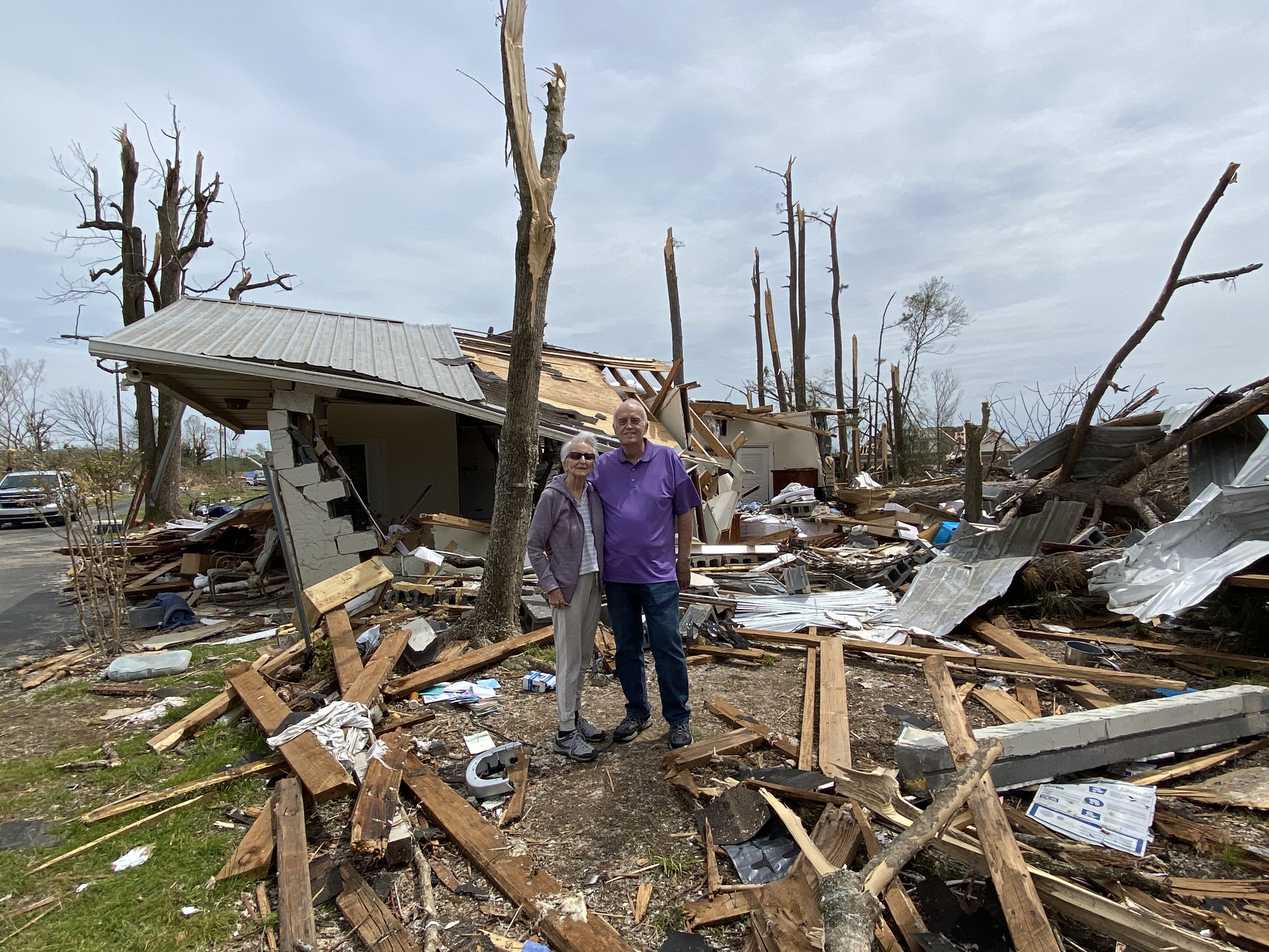 After a tornado ripped through their community, Bob and Lou Sauder stand in the rubble that was their house.