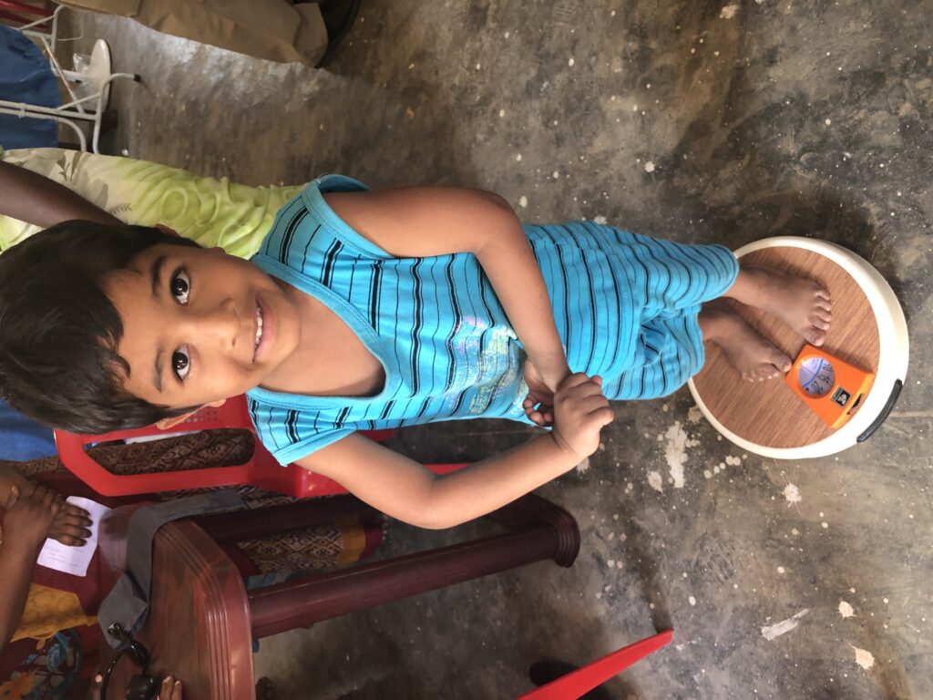 This boy is one of the villagers near one of the recently re-opened Adventist churches in east central India receive medical exams. 