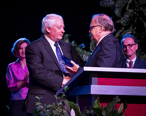 Larry Blackmer receives award from Dan Jackson