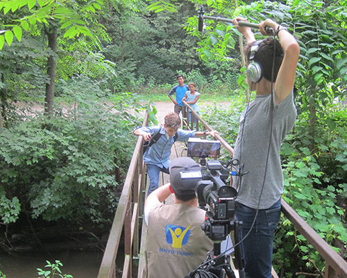 Film crew of The Mysterious Note captures a scene involving three of the film’s actors. 