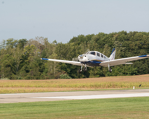 A plane lands at the university's Andrews Airpark.