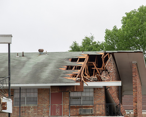 stock photo of tornado damage to apartment building
