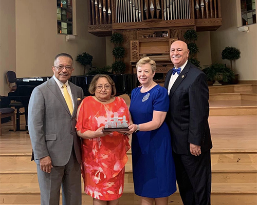 Buford Griffith, Carmen Griffith, Pamela Consuegra, and Claudio Consuegra, pose during an award presentation of the NAD Family Ministries’ annual Family Research and Practice Conference.