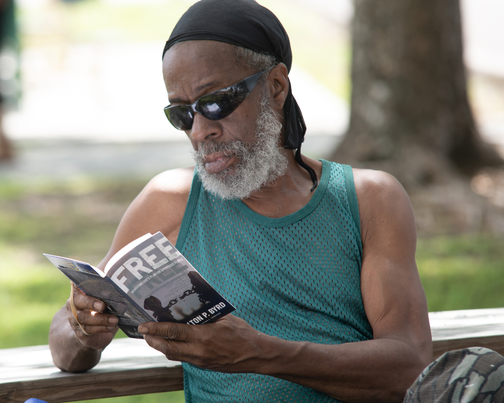 Community member in Miami-area reads a copy of FREE