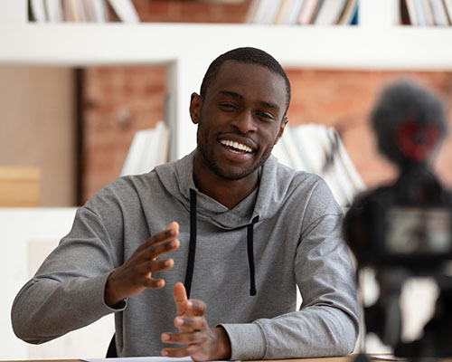 stock photo of african american man lecturing on camera