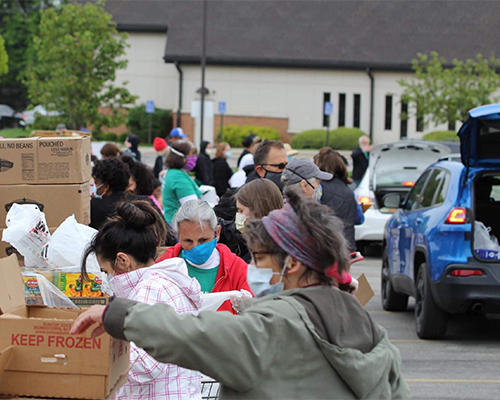 Renewed Hope volunteers sort food for distribution. 