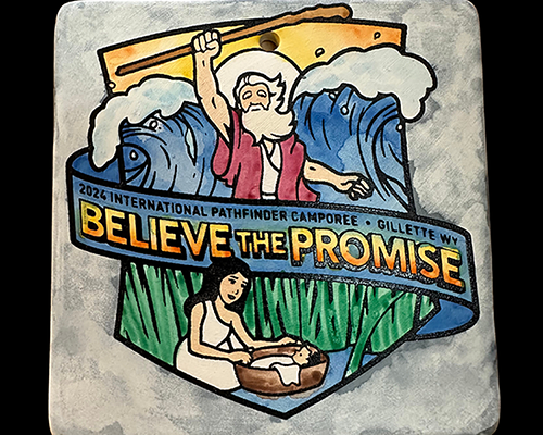 Photo of Believe the Promise logo emblazoned on pottery. 