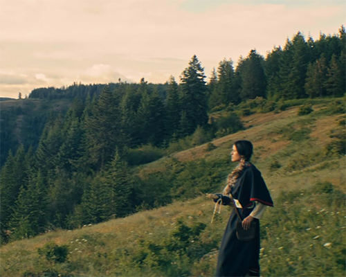 Melissa on the hillside, image from Color of Threads
