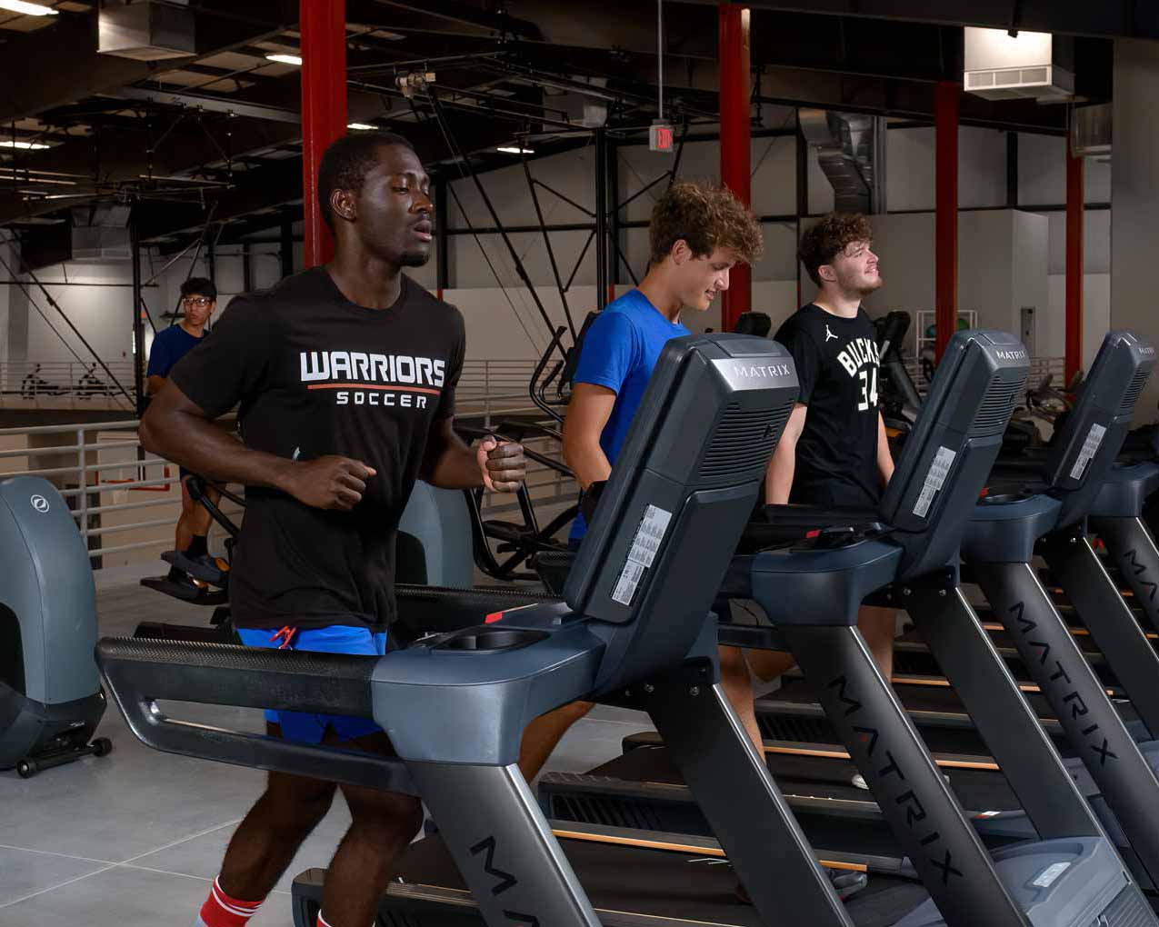 People exercising in a gym.