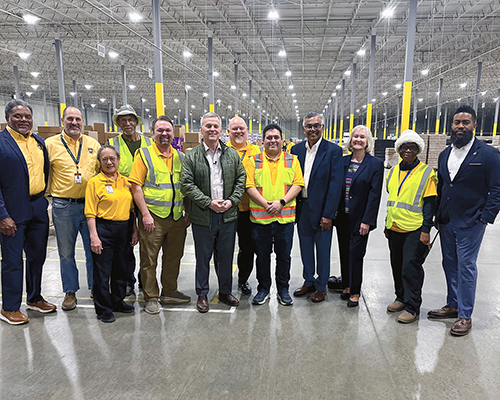 Diverse group of people standing in a warehouse