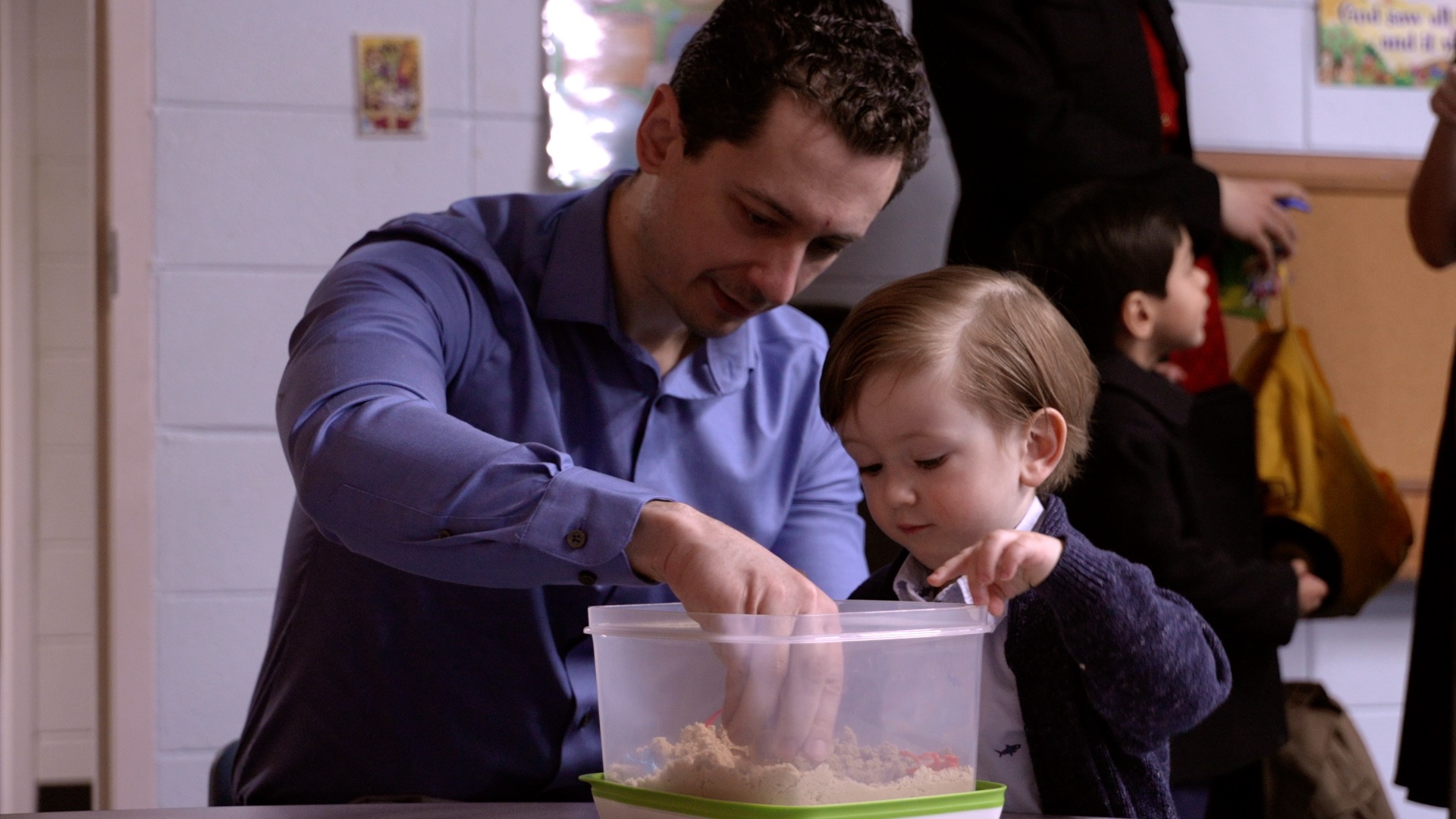 A Father and son do an interactive activity at Sabbath School