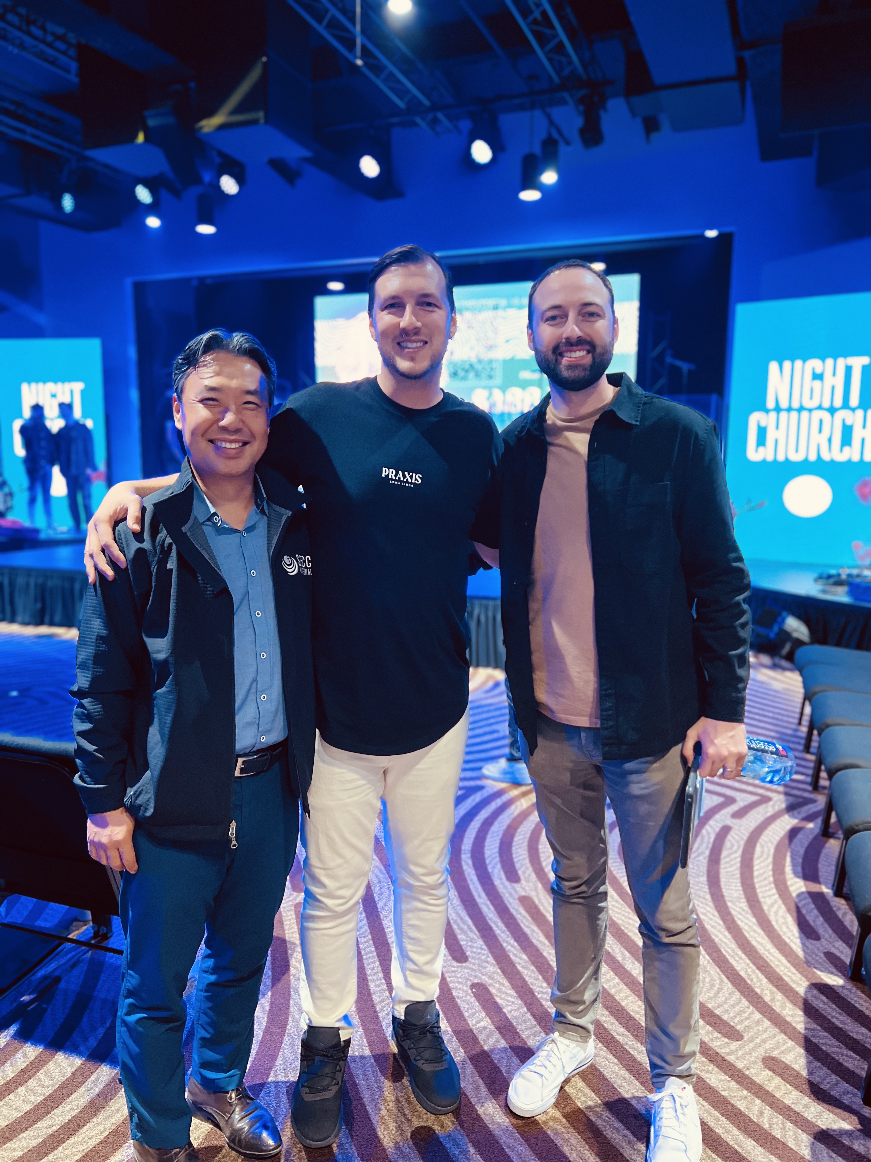 03 Jon Filip Aren.jpg – [L to R] Dr. Jonathan Park, SECC President; Dr. Filip Milosavljevic, LLUC Young Adult Pastor; and Pastor Aren Rennacker, SECC Youth and Young Adult Director, enjoy the Voices of the Young Friday service as part of the NAD’s Young Adult LIFE Tour.