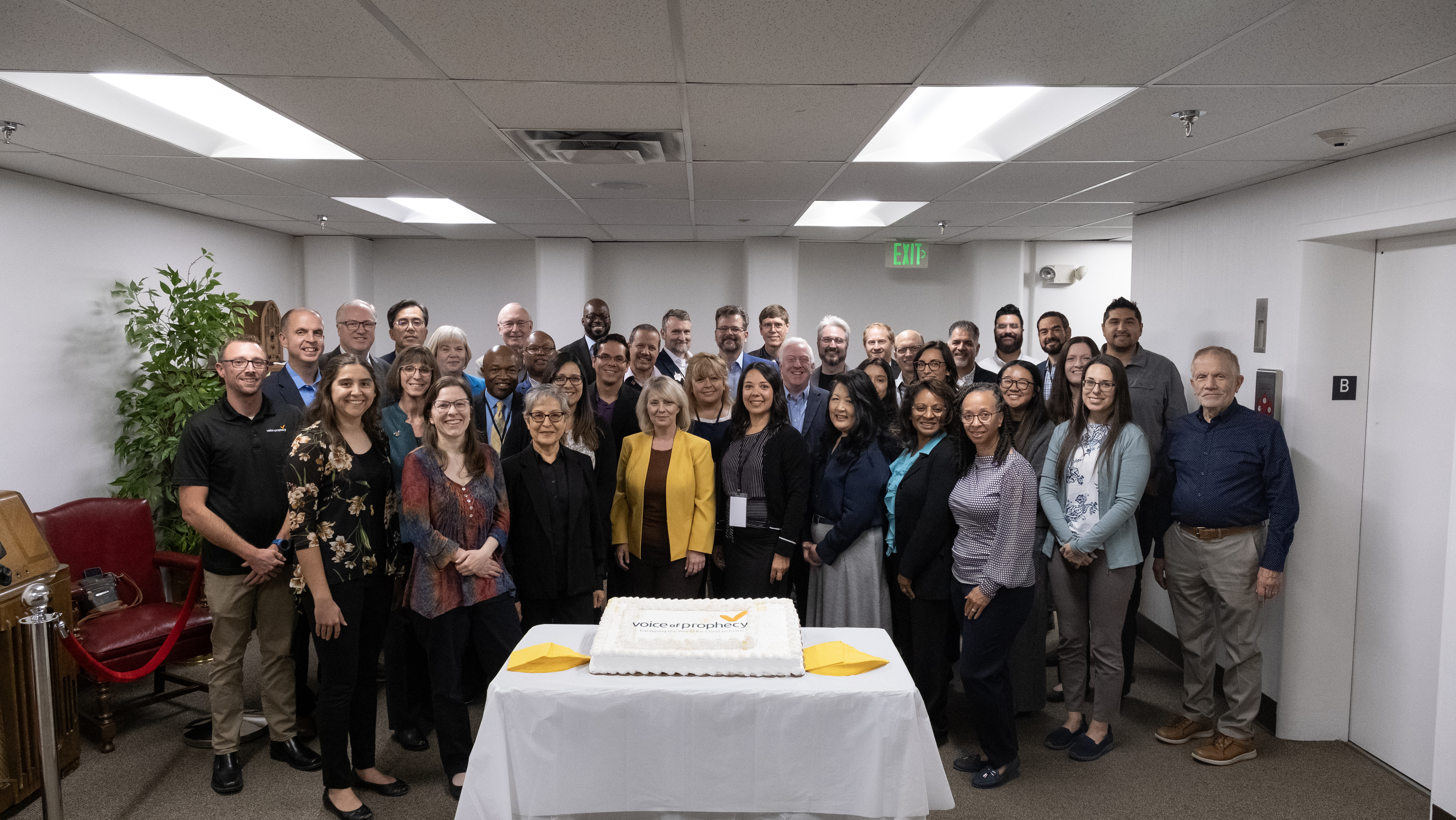 The Voice of Prophecy team gathers with their executive committee to celebrate the ministry’s upcoming 95th birthday. In September, the committee visited the ministry’s office in Loveland, Colorado, and several partook of a birthday cake.