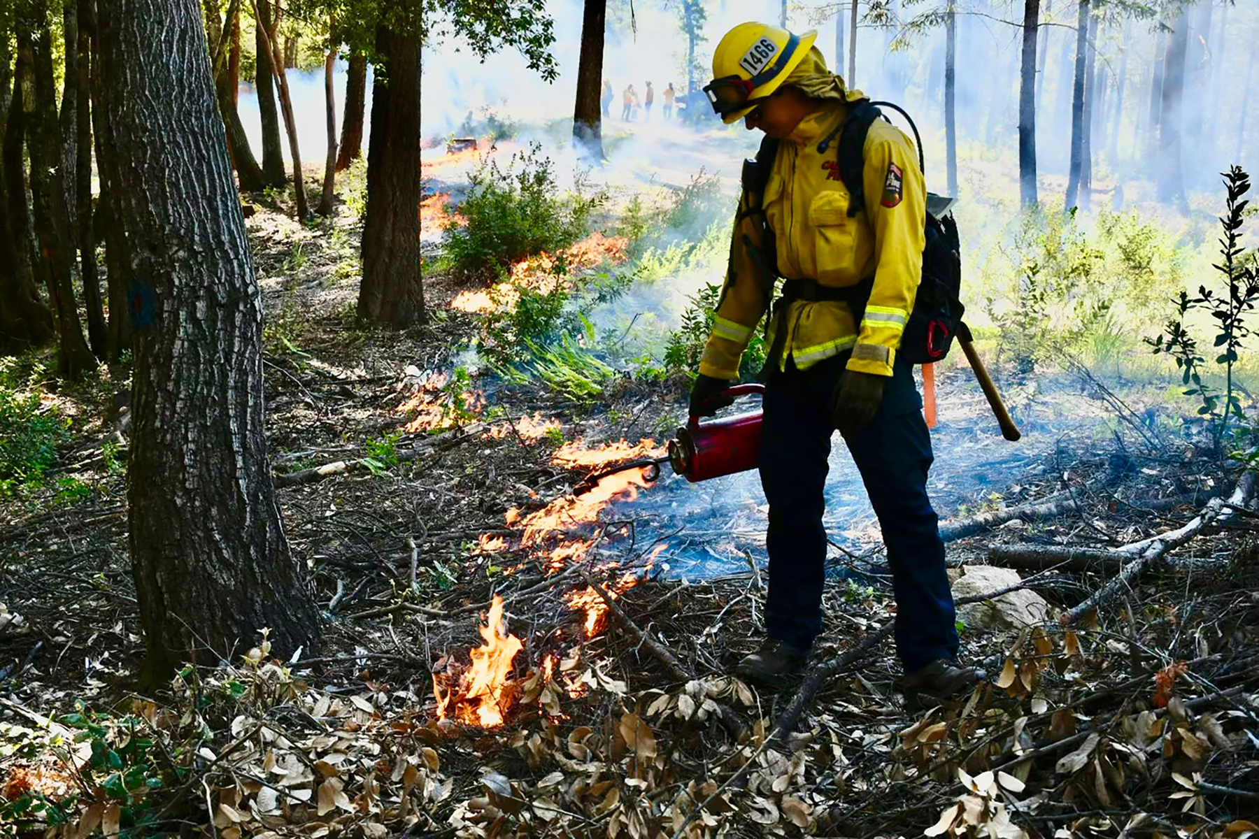 Firefighter putting out fire.