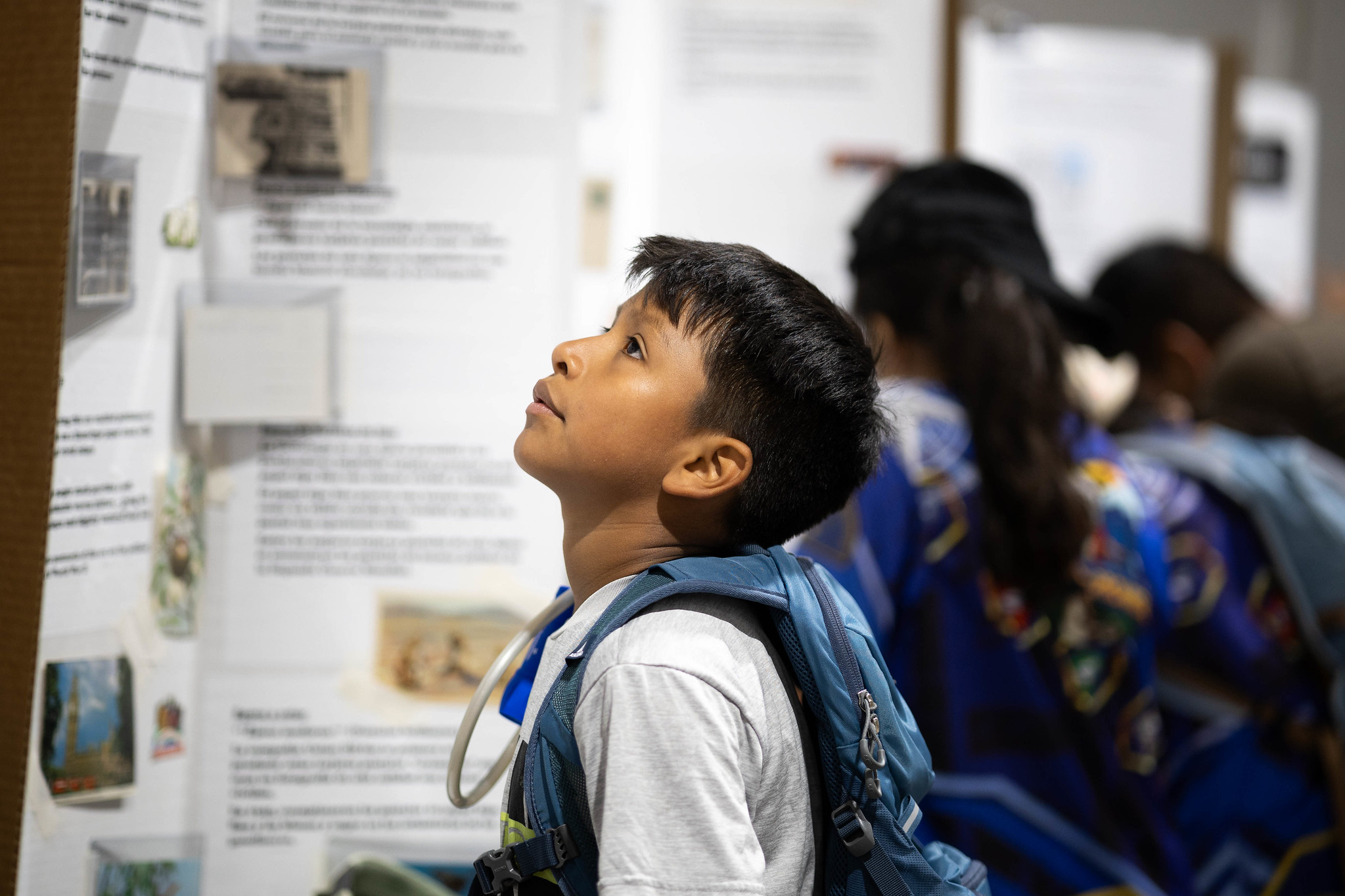 Young boy looks at display at the education center of the camporee in Gillette, Wyo