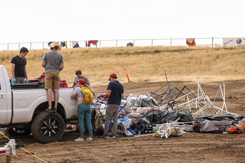 Pathfinders assist with camp cleanup the morning after the storm at the Believe the Promise International Pathfinder Camporee in Gillette Wyoming. Photo: Dawin Rodriguez | North American Division