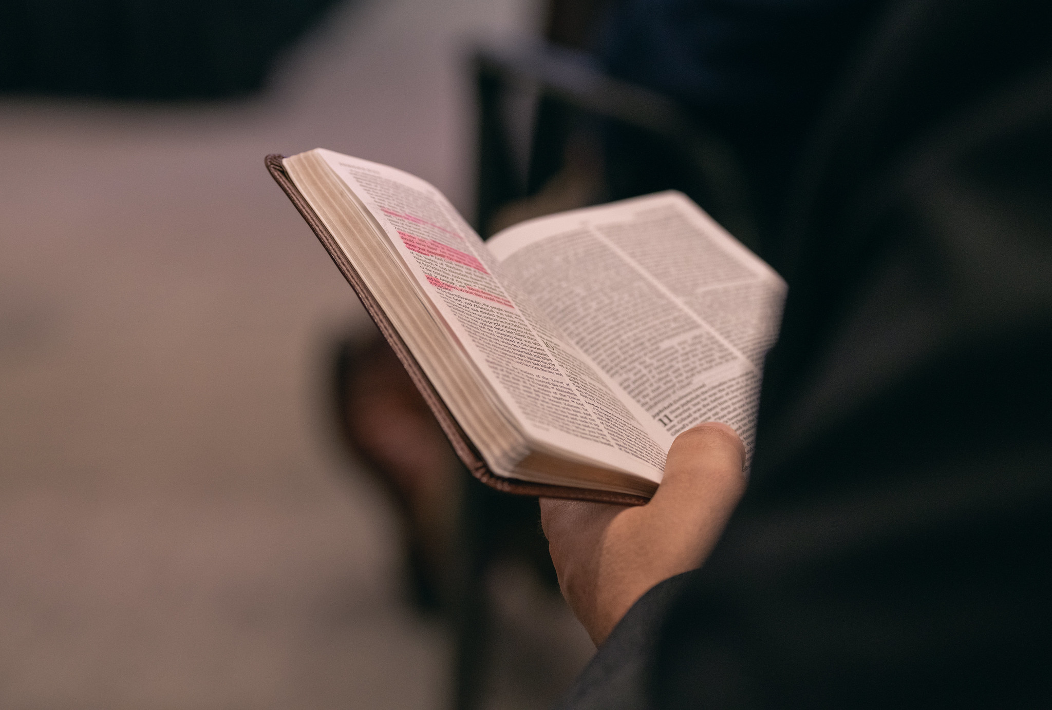 Bible and hand/person reading