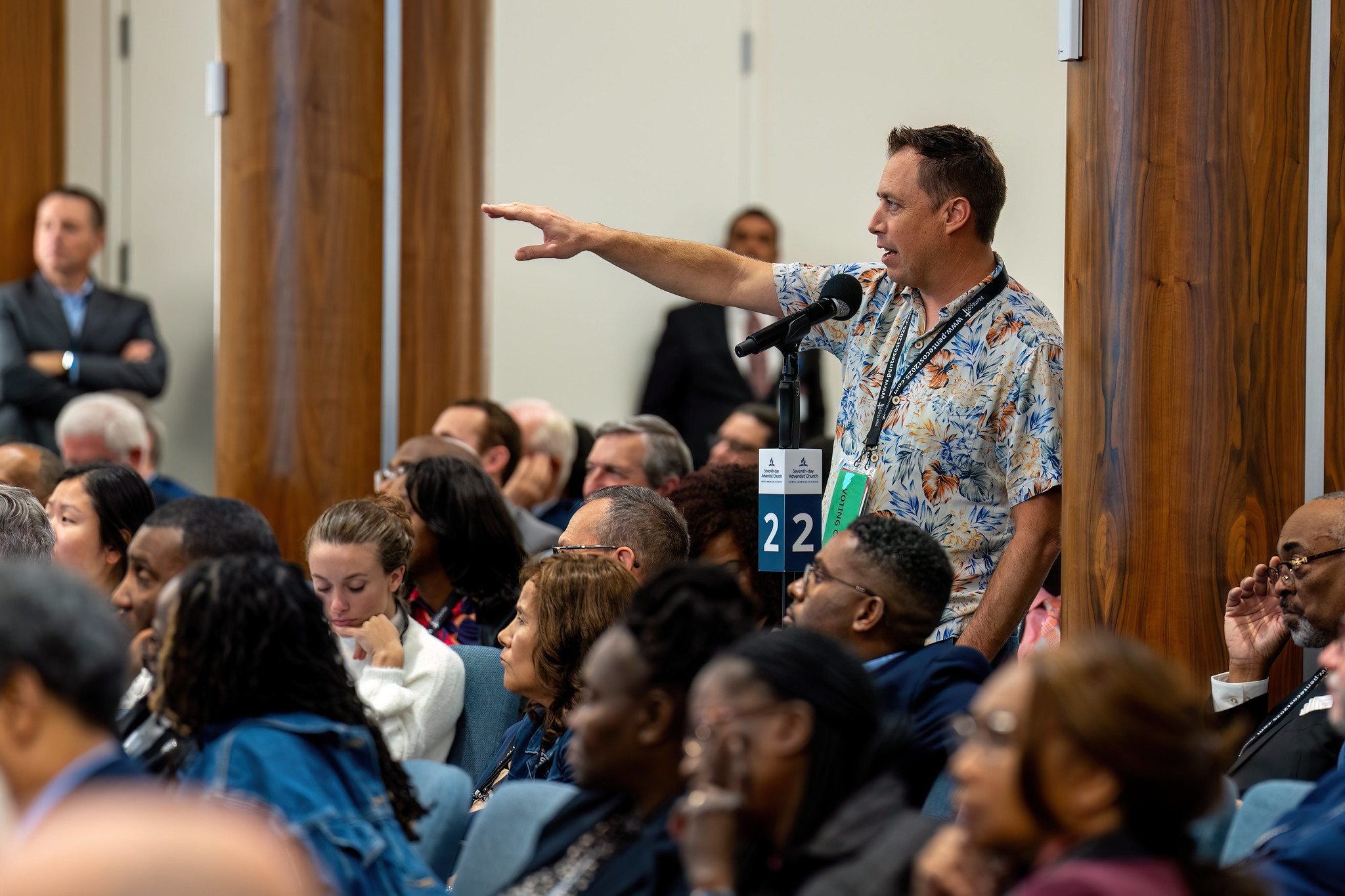 Attendee (?) asks a question about a proposed policy change. 