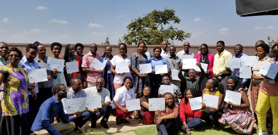 Participants of the three-day training on “Assisting Individuals in Crisis” display their certificates of completion.  