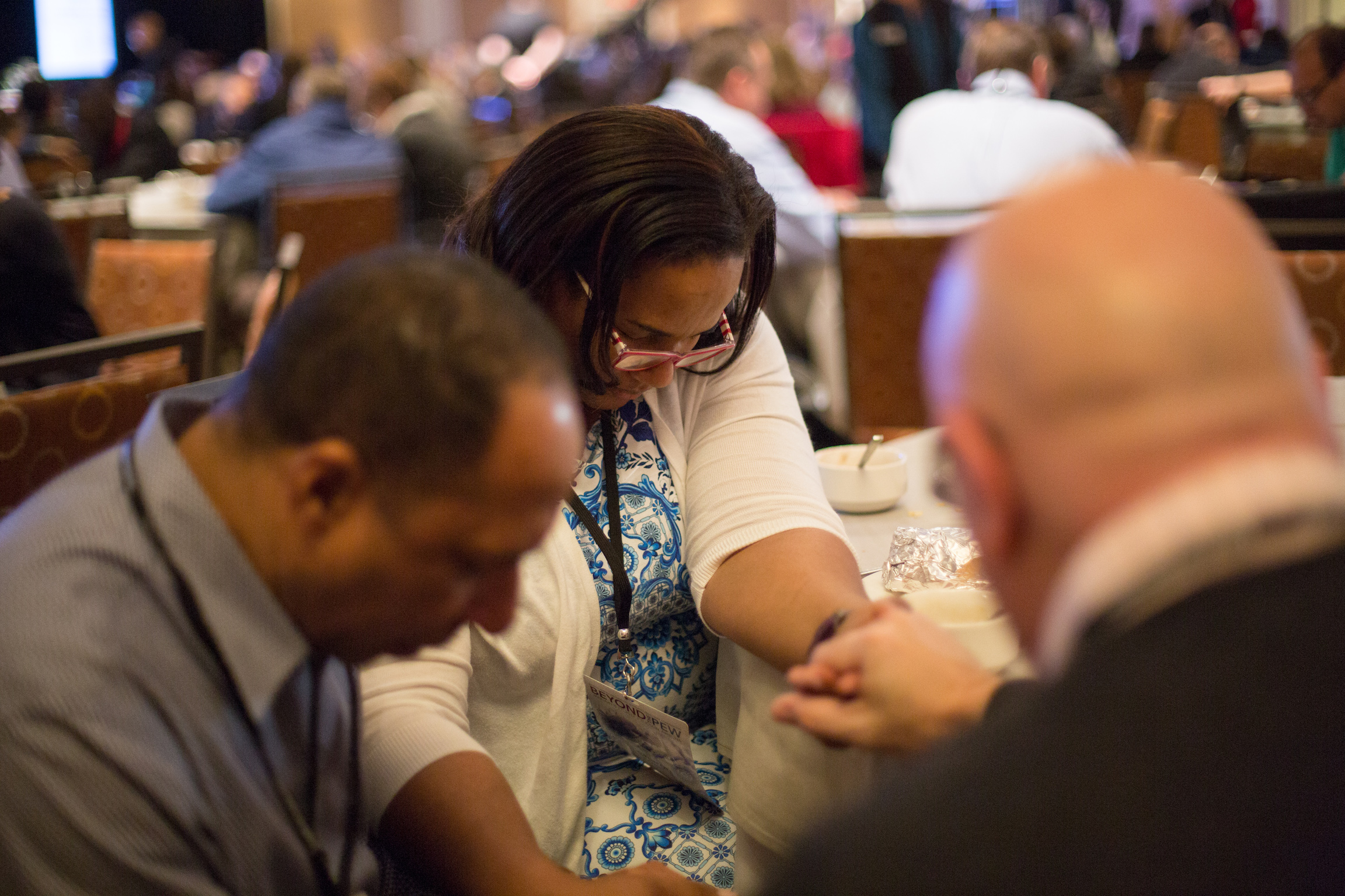 Adventist Ministries Convention attendees pause for prayer during morning devotional. Photo: Pieter Damsteegt