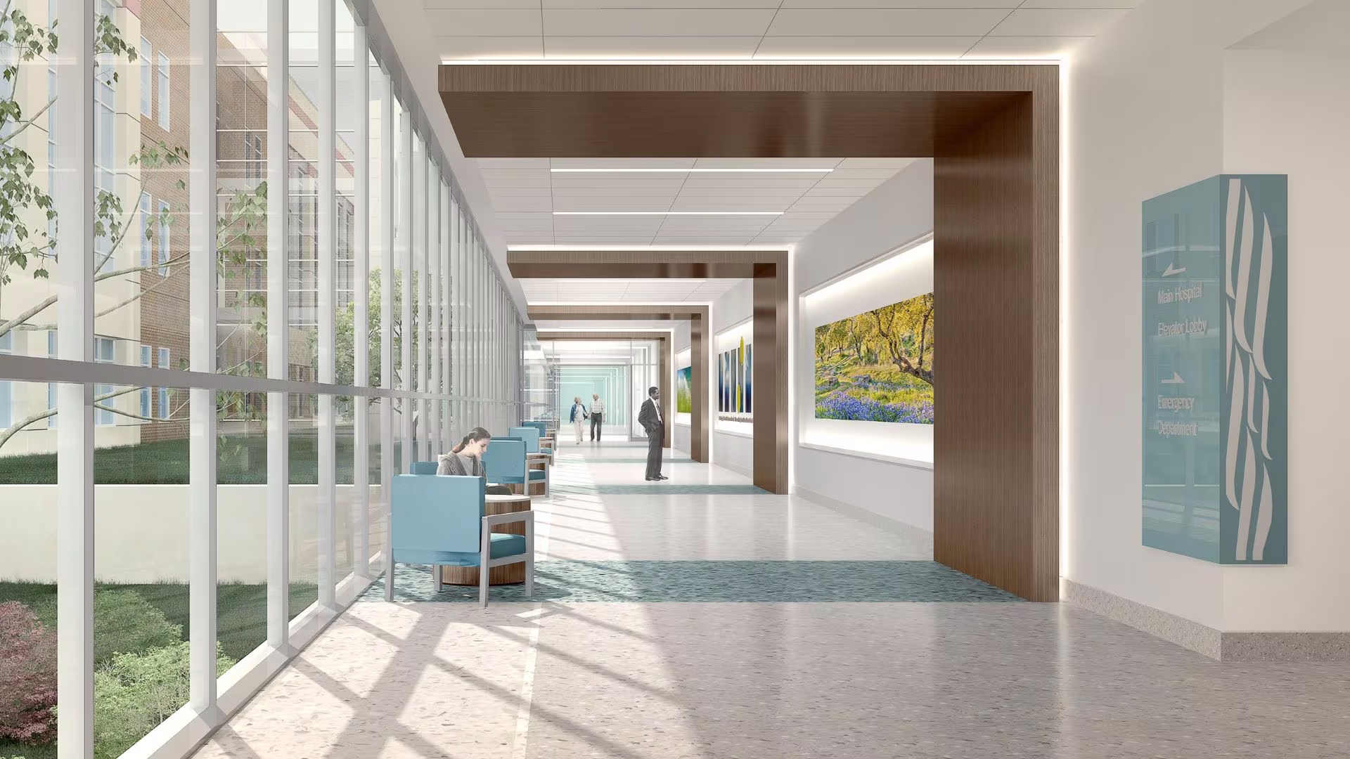 A hospital lobby with large windows.