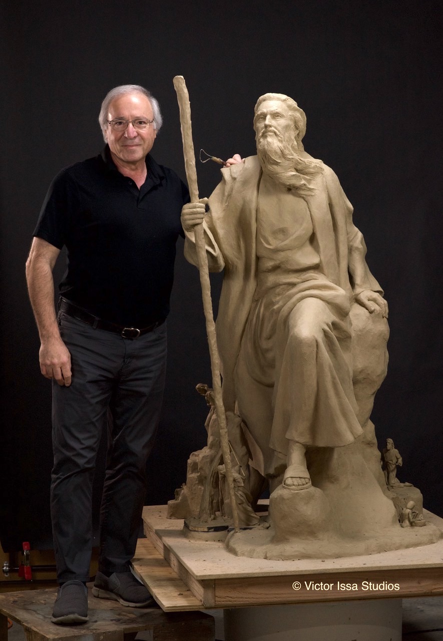 Victor Issa with his clay sculpture of Moses