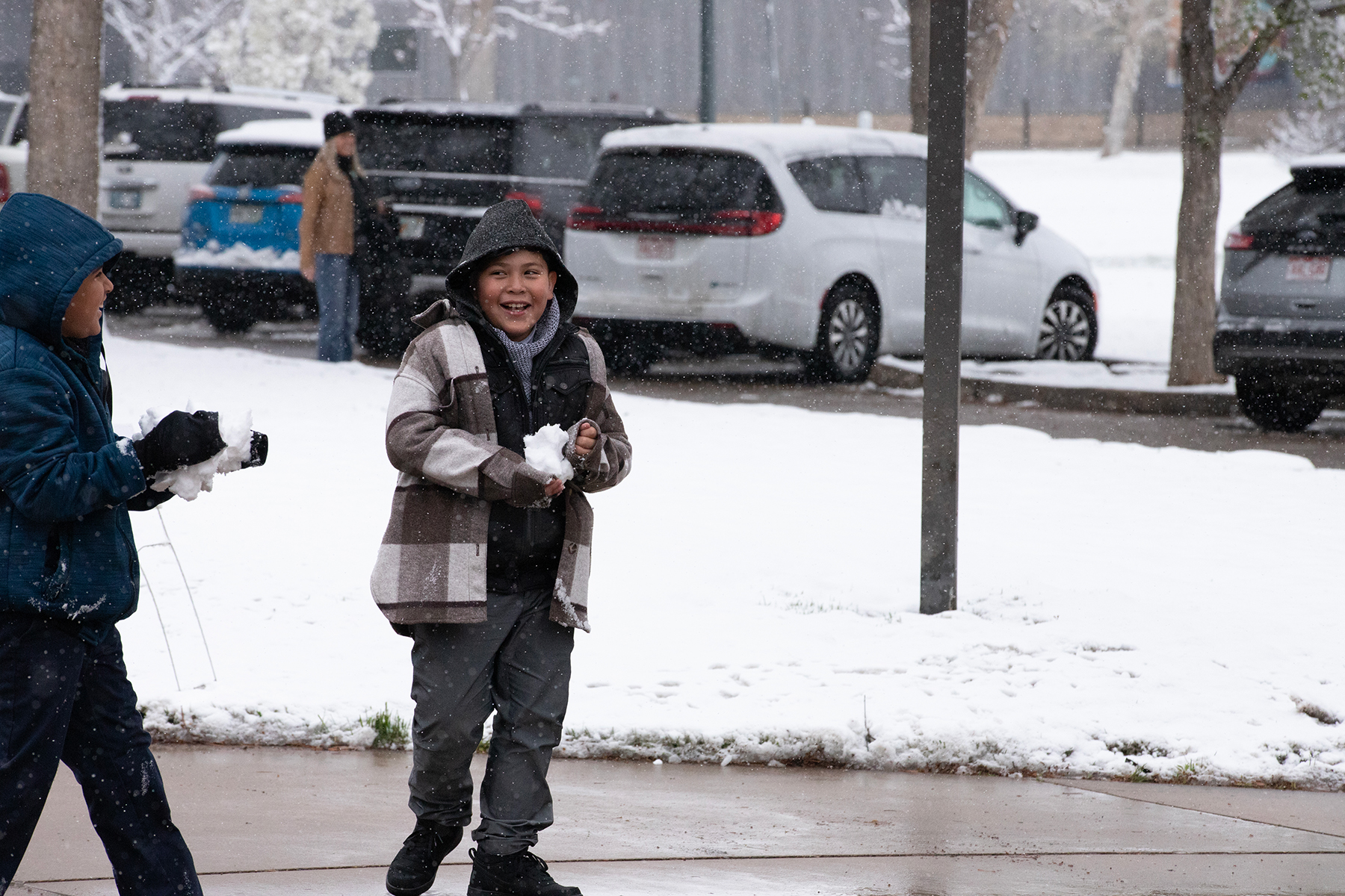 Two boys playing in the snow