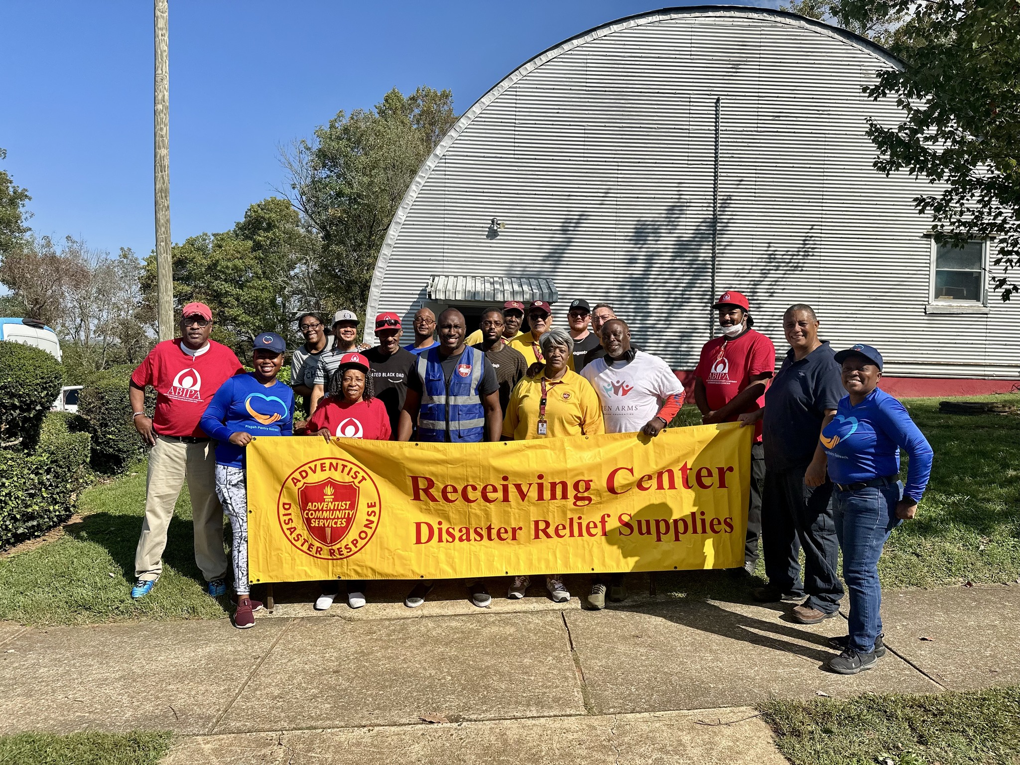 CAPTION: Volunteers from ABIPA at the downtown distribution center. They are partnering with the S. Atlantic and Carolina Conference in this warehouse.