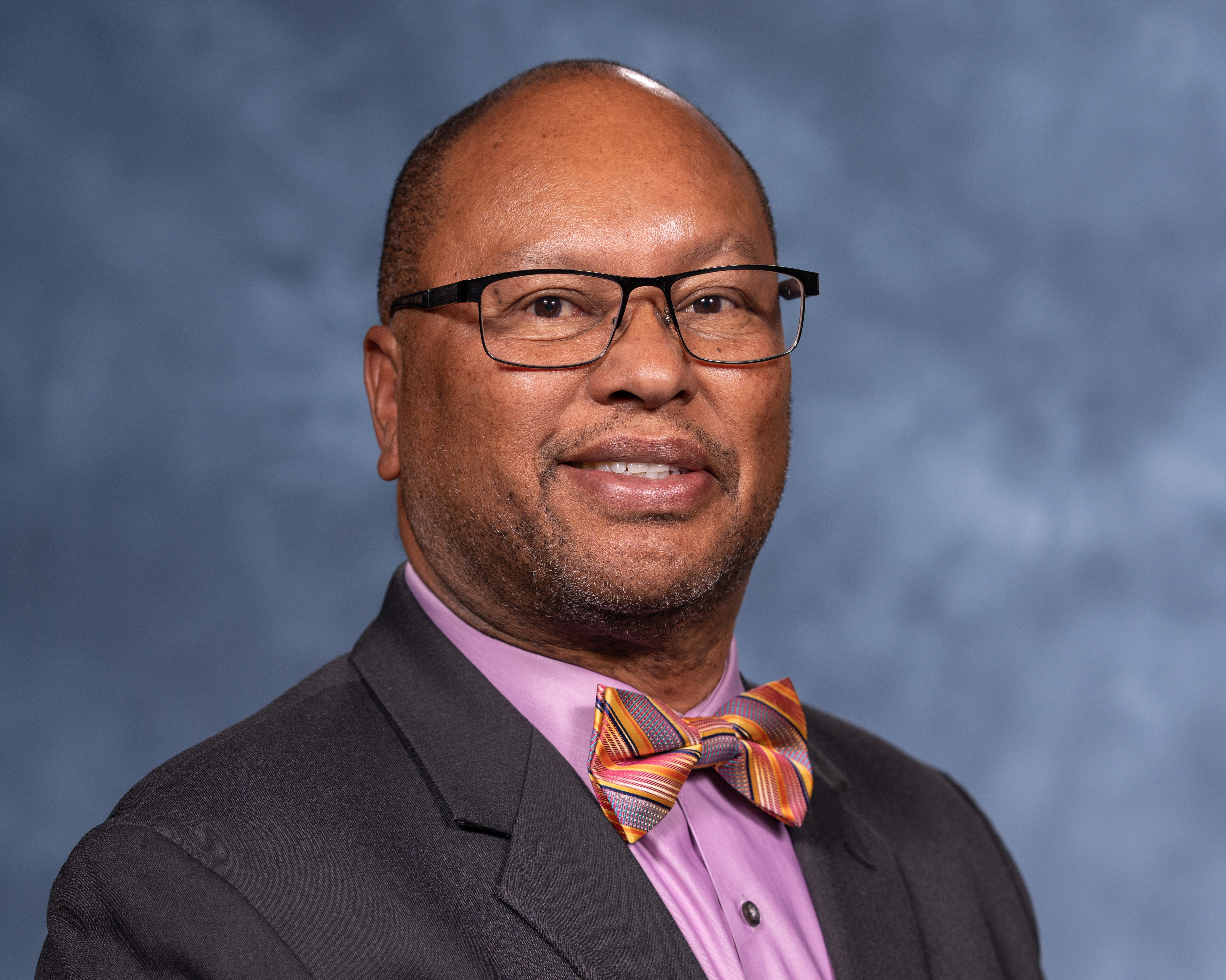 Headshot of a smiling black man