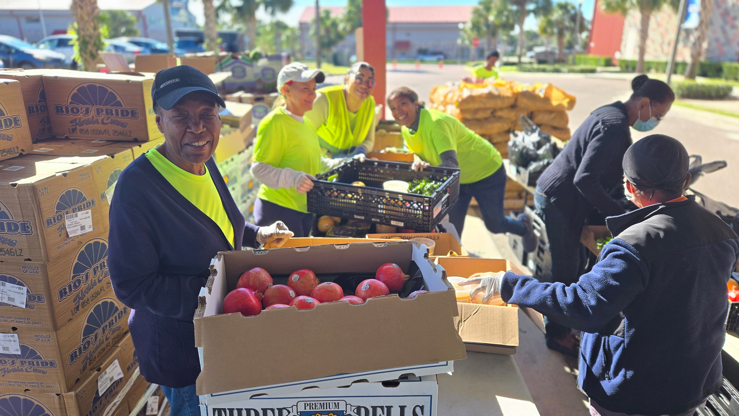 Smiling volunteers at a mobile food pantry