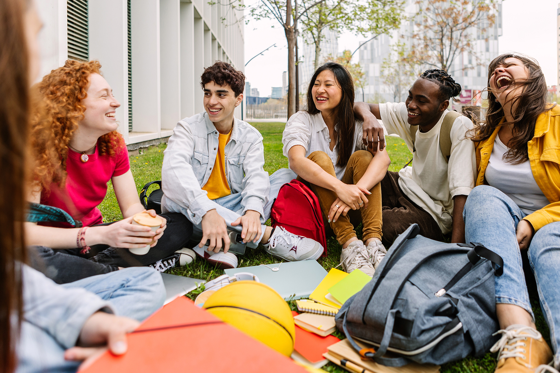 A diverse group of students study outside. 