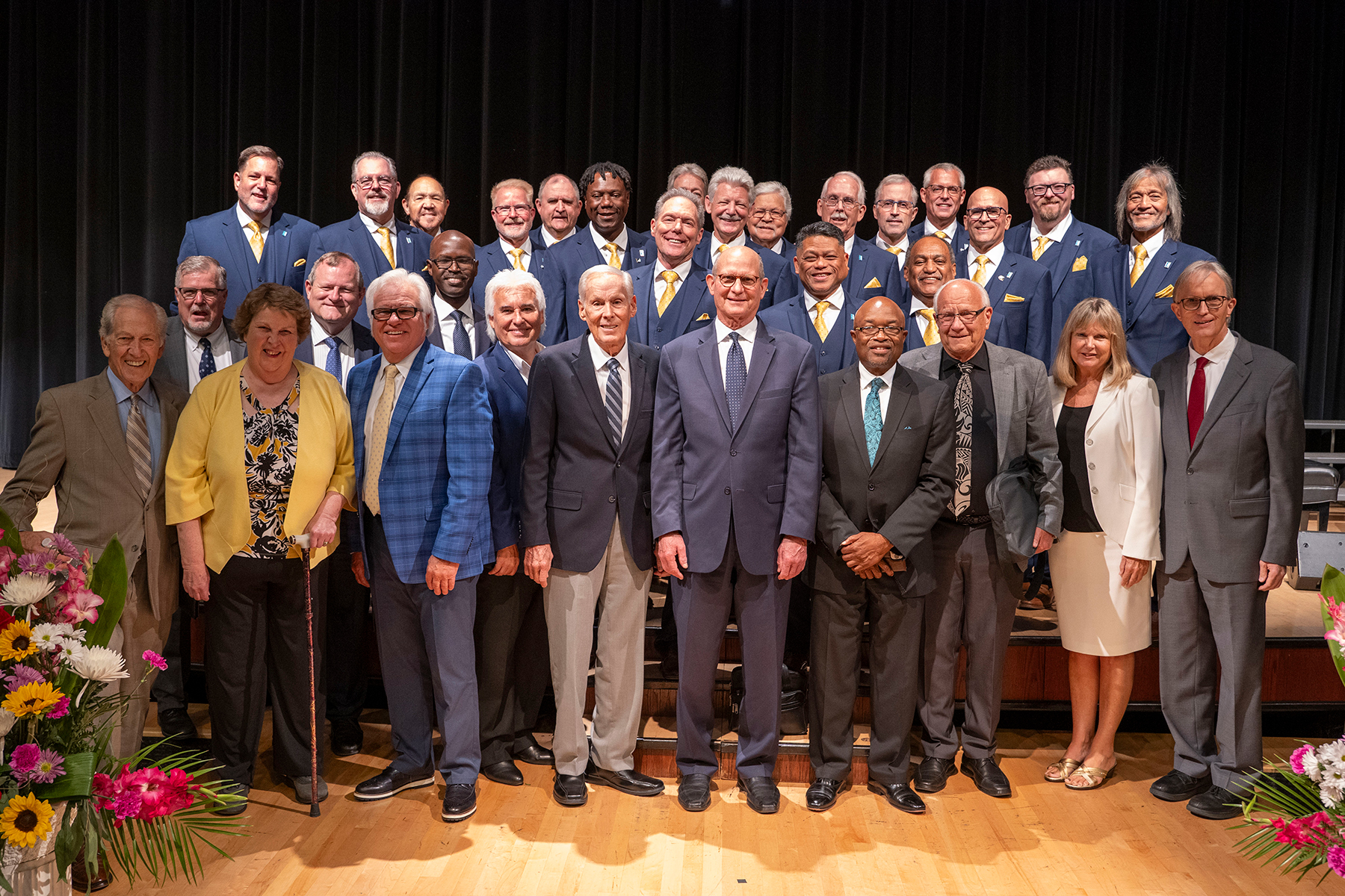 A diverse group of individuals pose for a group shot