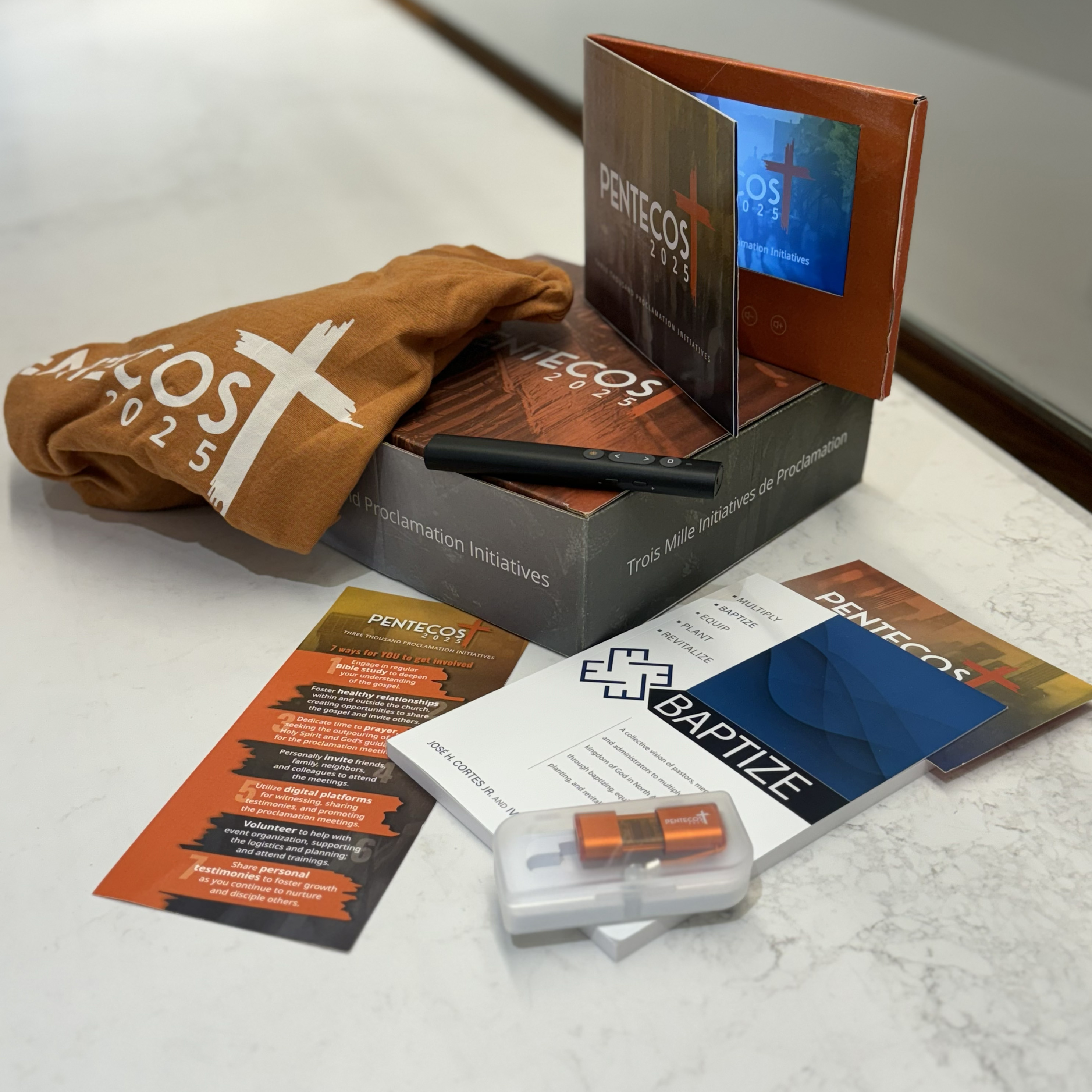 Pentecost 2025 welcome kit with video message player, T-shirt, etc.