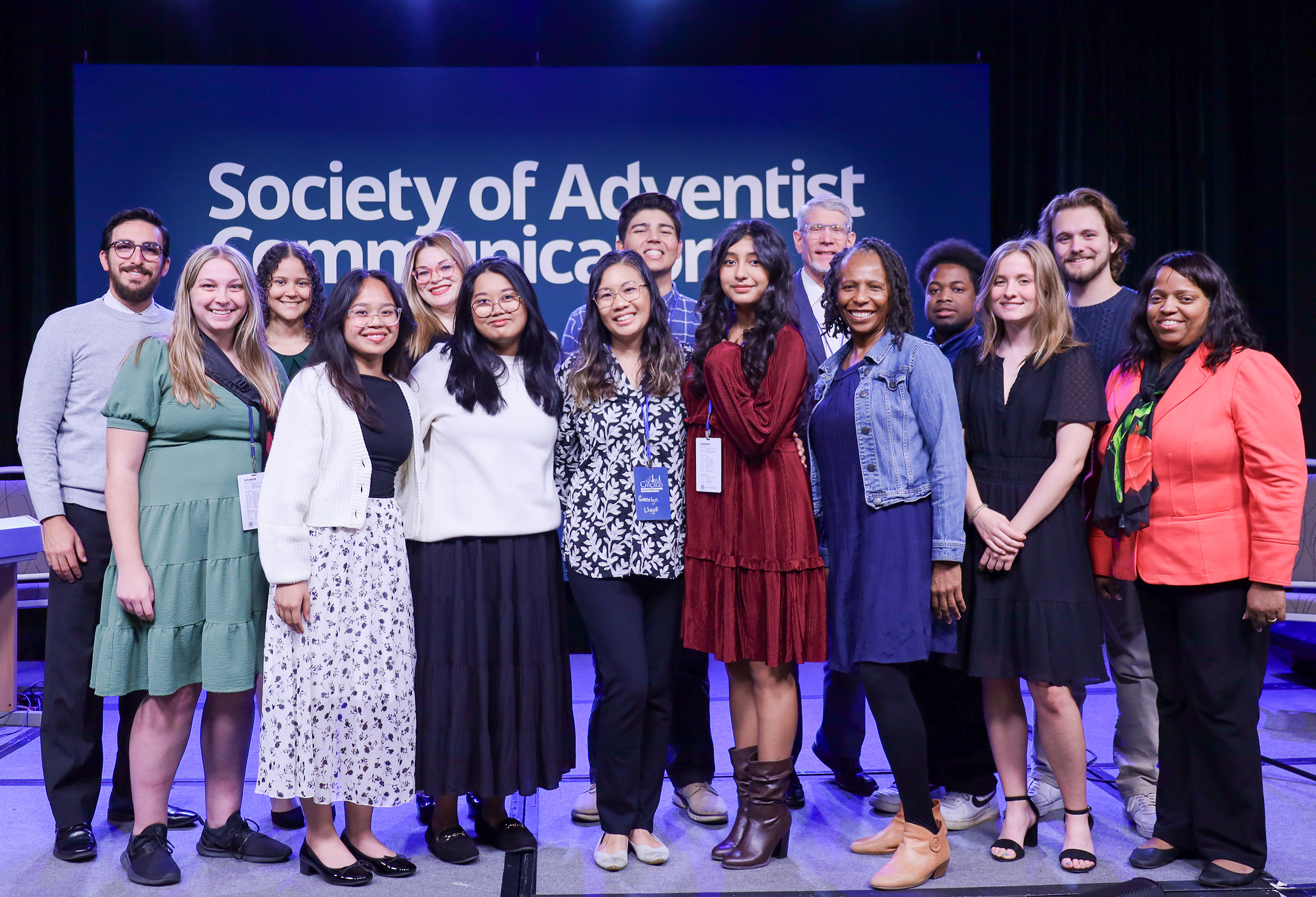 Diverse group of students and professors on stage at Society of Adventist Communicators convention