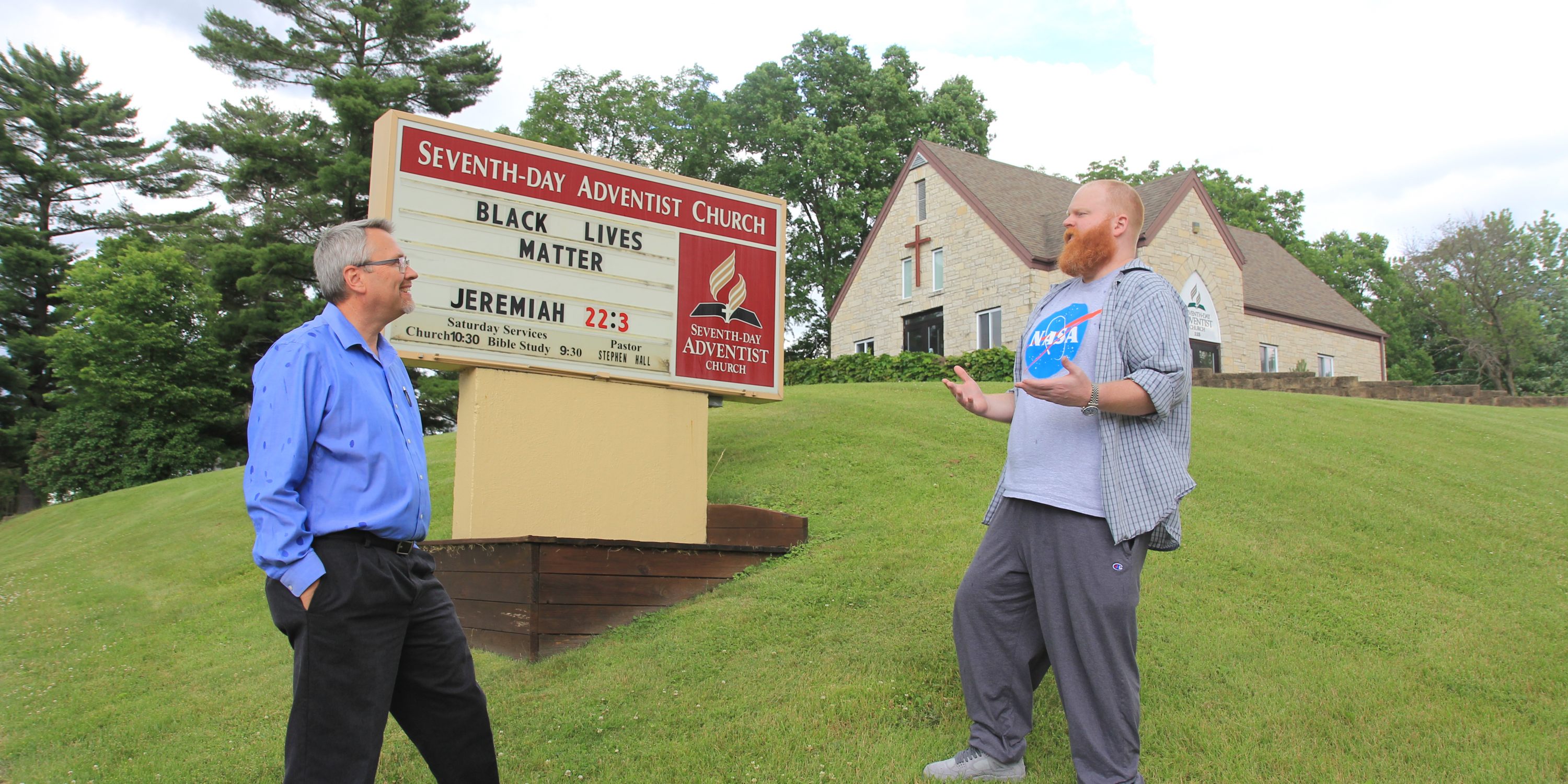 Stephen hall and church elder at Reedsburg church sign