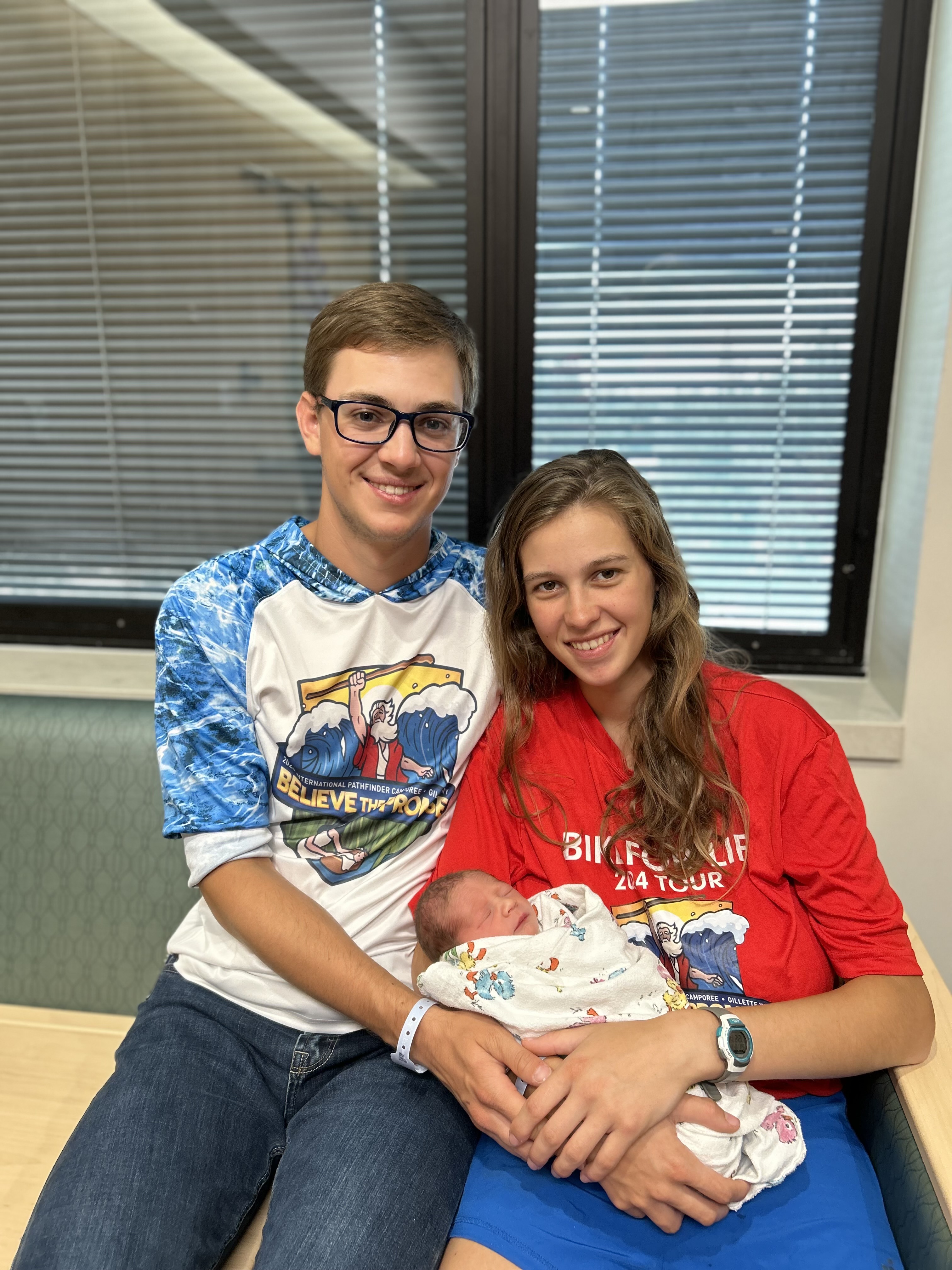 Two young adults with their newborn baby in Gillette, Wyoming