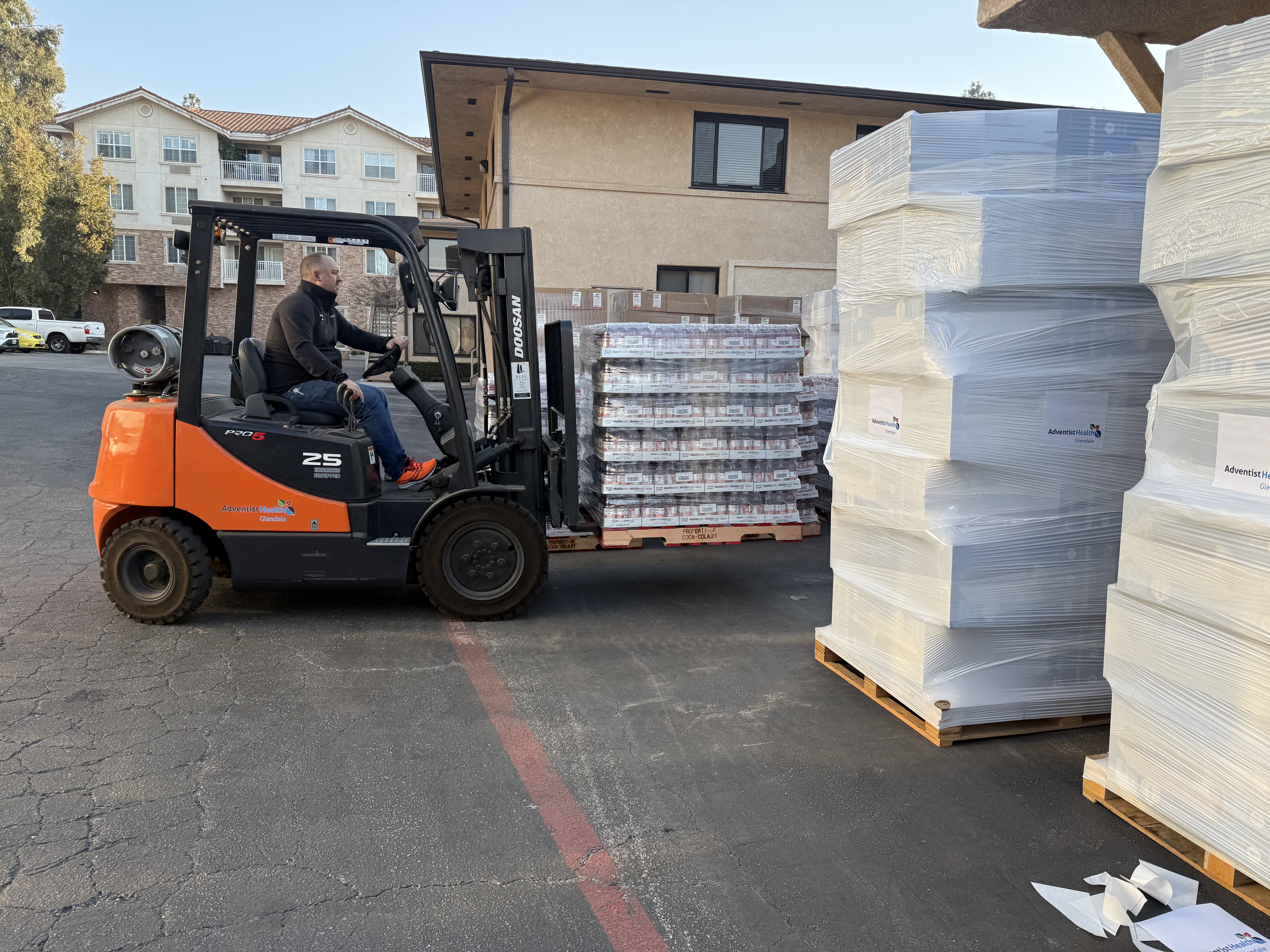 John Schroer organizes donated supplies in the distribution area.